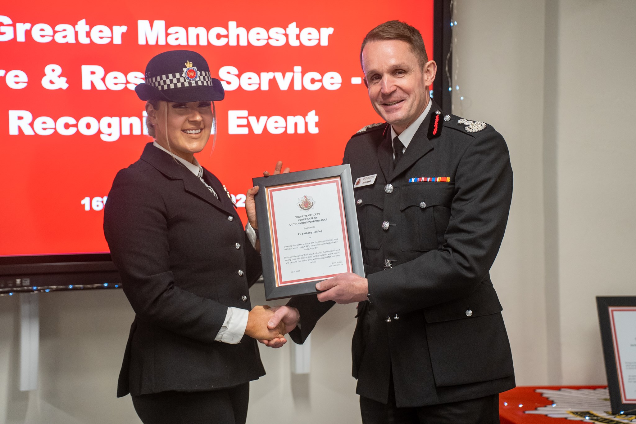 PC Beth Holding receiving her award from CFO Dave Russel