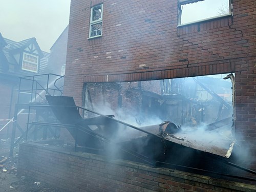 Smoke around the extinguished fire in derelict building