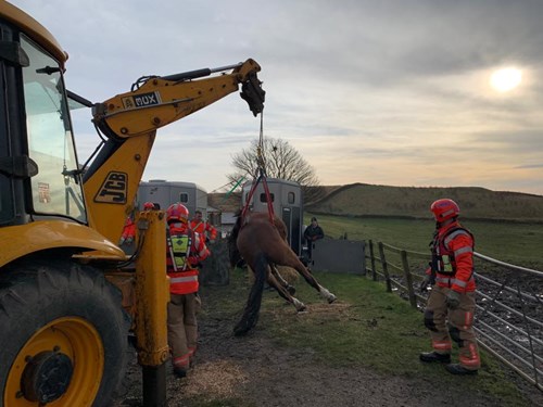 Atlas being lifted by a JCB