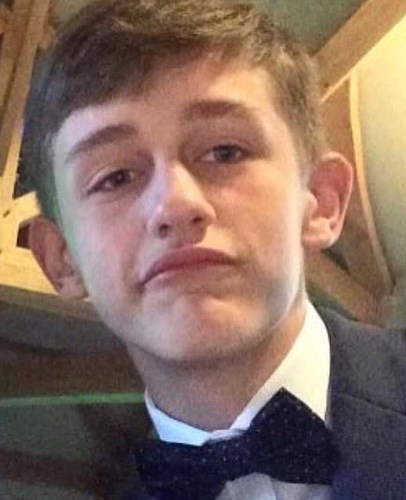 Jack Pullen -  A young man with short brown hair, wearing a formal suit and bow tie and is slightly smirking at the camera