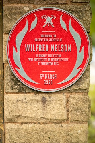 The red plaque for firefighter Wilfred Nelson