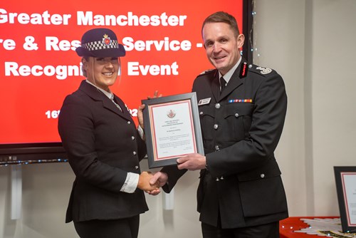 PC Beth Holding receiving her award from CFO Dave Russel