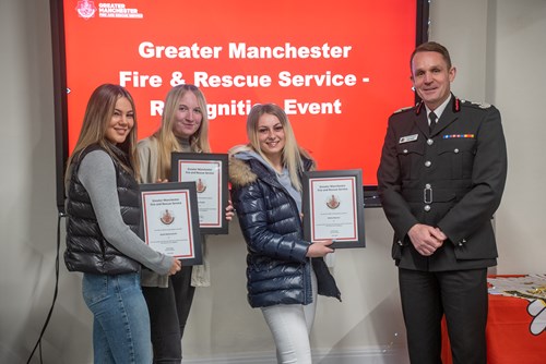 Emily, Katie and Alisha receiving their awards from CFO Dave Russel