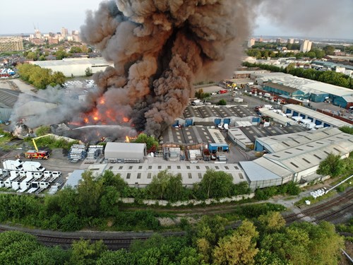 Aerial shot of fire at industrial units in Manchester
