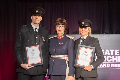 Watch Manager, Marc Howson and Firefighter, Emma Davies receiving their Certificate of Outstanding Performance from Lord-Lieutenant of Greater Manchester, Mrs Diane Hawkins JP LLB.