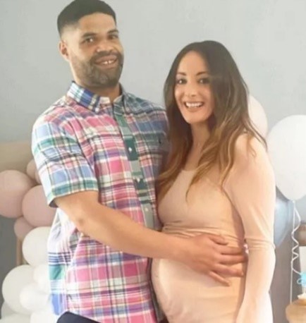 Calvin Buckley with arms around Frankie Julia Hough with balloons in background