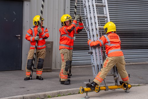 Firefighters with a ladder at the Training and Safety Centre in Bury